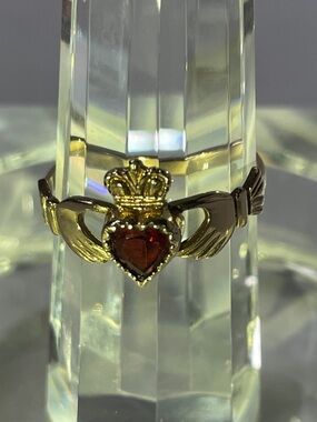 10k Gold Claddagh Ring with Garnet Red Stone.  Size 6.